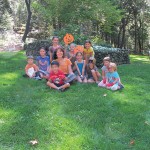 Pamela and young friends gather for an early autumn river clean-up day.