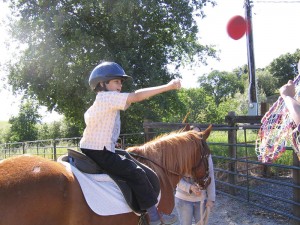 Handi-Riders student Ben Jensen, age 11, rides Penny, an American Quarter Horse cross.