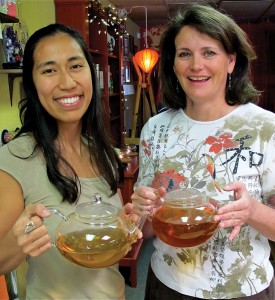 Sereni-Tea in Mt. Shasta offers over 150 types of tea, including three types of chai. Owner Daniella Bose (r)  and sales associate Vixie Javier (l) offer their "brew of the day" in the shop's sampling room. 
