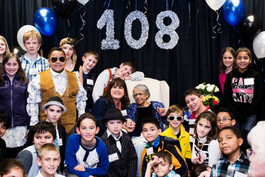Beth and her students visit Amber Grove Place in Chico to celebrate resident Florence's 108th birthday. "My class and I visit monthly," says Beth. "My 33 fifth-grade students presented Flo with decades posters spanning her life." Photos by Teresa Raczynski, Park Avenue Photography