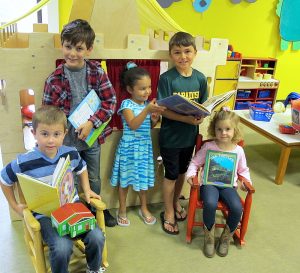 Young children love the colorful play area at Paradise Branch Library. Colton, Lowell, Peyton, Jayden and Chloe are all excited about the comfy child-sized chairs and great books!