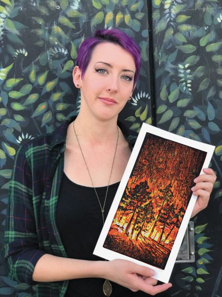artist Makaylah Fazzari holds her Carr Fire illustration