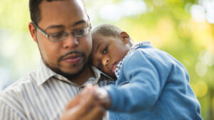 Children's Emotions - Sad young boy with Dad comforting him