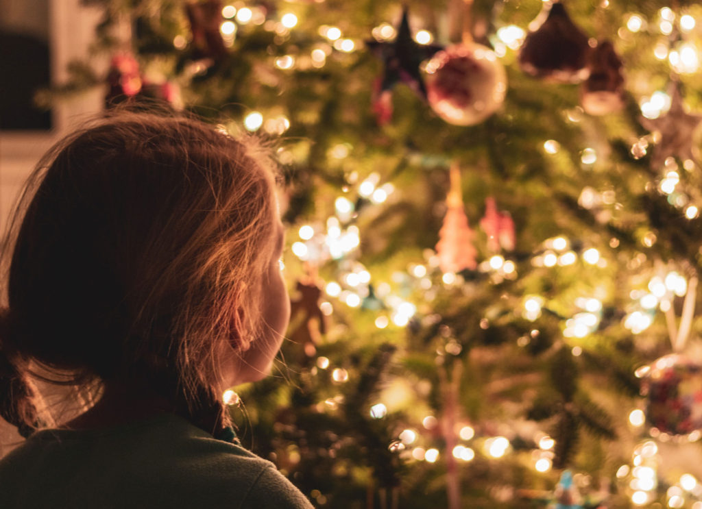a child thinking about Repurpose Your Christmas Tree - north state parent