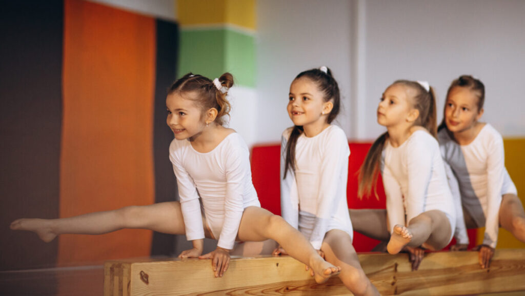 Group of girls exercising at gymnastic school