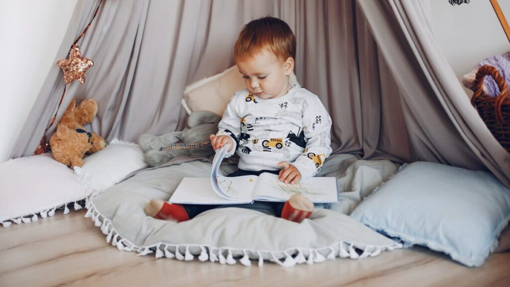 Cute little boy have fun in a room. Child playing at home