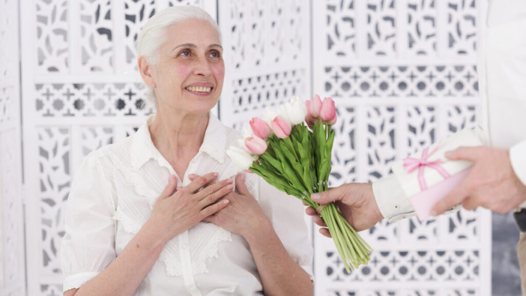 elderly getting flowers