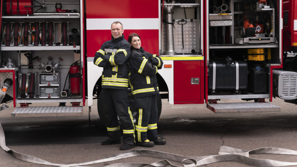 male-female-firefighters-station-working-together