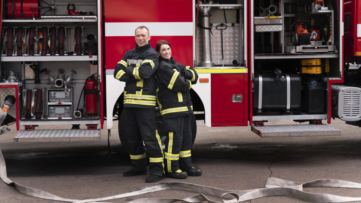 male-female-firefighters-station-working-together