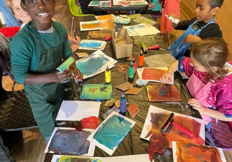 Students enjoy creative expression through an Exploration workshop printmaking project.