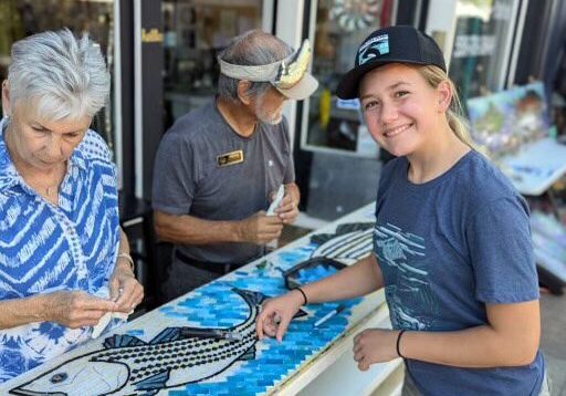 Oroville teen Caitlin has worked regularly on the mural project for years.