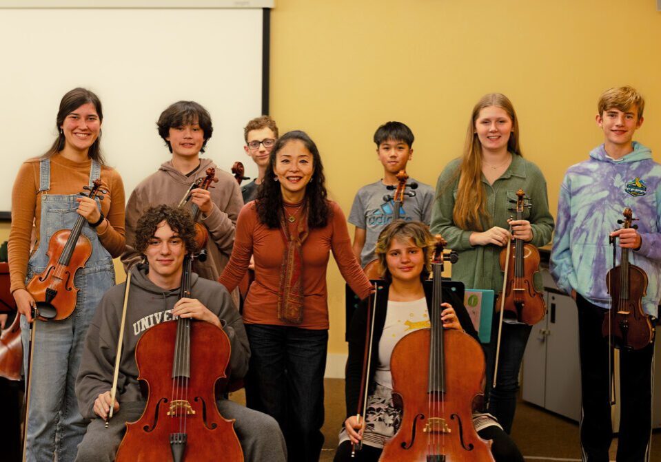 Yoshie Muratani teaches orchestra students to work together, playing important notes as characters, each part contributing to the story of the music. Photos by  Isabel Ruiz.