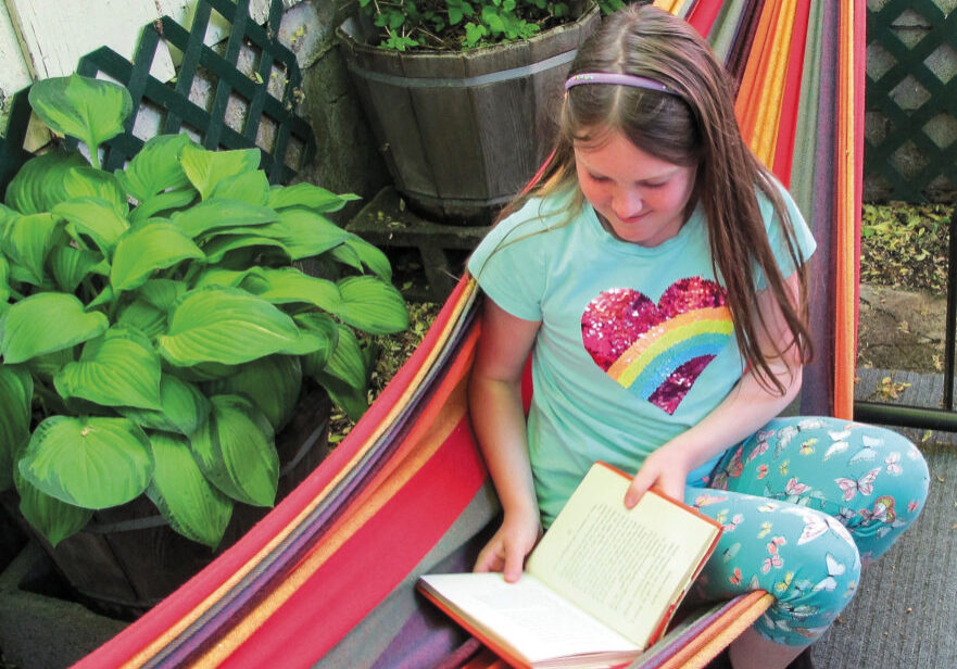 Allandria’s favorite place to be on warm days is outside with a good book.