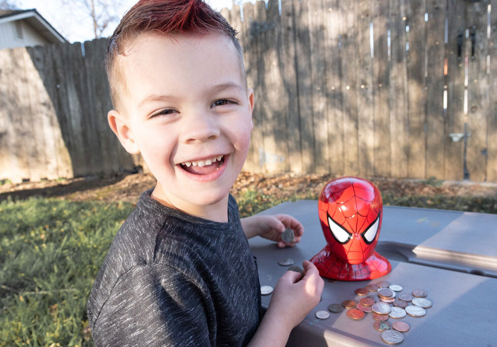 Dustin, age 4, is learning about math and how savings add up.
