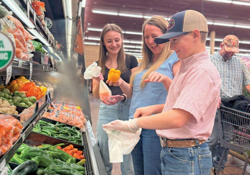 The Sater family enjoys shopping for tasty in-season produce at Holiday Market in Cottonwood.Photo by Amber Murray