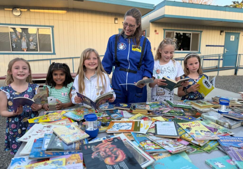 Darla shares her joy of reading with children at the Bend School through specially themed-literacy nights, after-school activities and clubs.