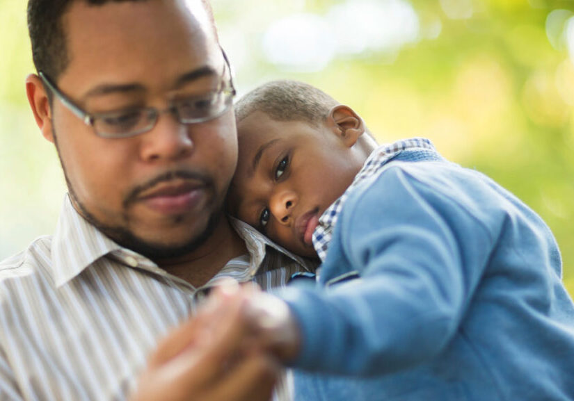 Children's Emotions - Sad young boy with Dad comforting him