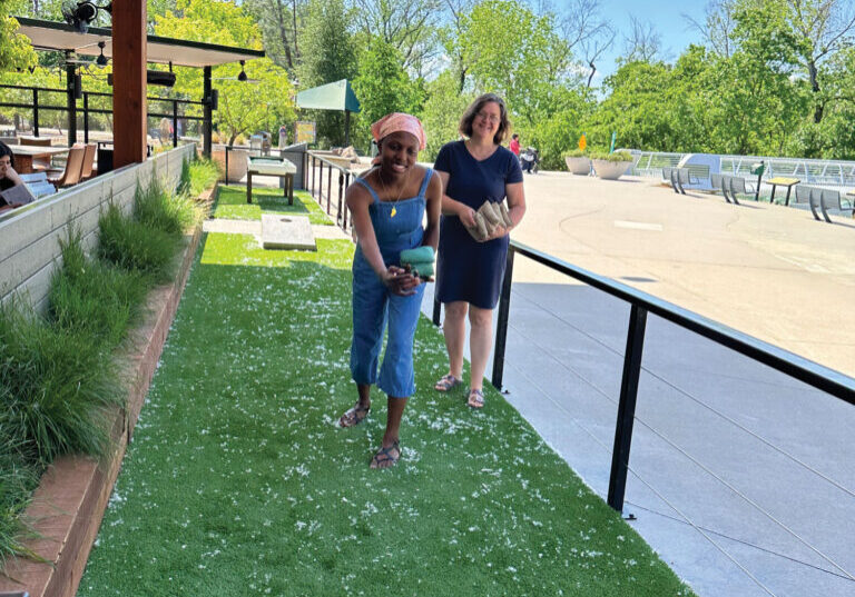 Selah and her mother, Linda Martin, 
get in a fun game before lunch at Branch House Riverfront Bistro in Redding.