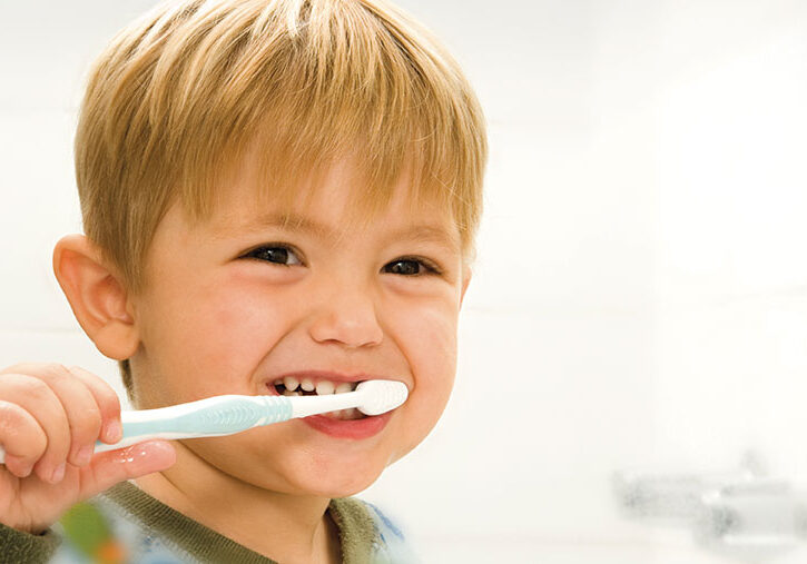 Improving Oral Health - a kid brushing his teeth - north state parent
