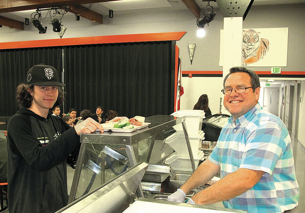 Dun­smuir High School  instructor Jeff Capps helps serve healthy and delicious culinary creations in the school’s cafeteria, all prepared by students enrolled in the school’s Culinary Arts program.