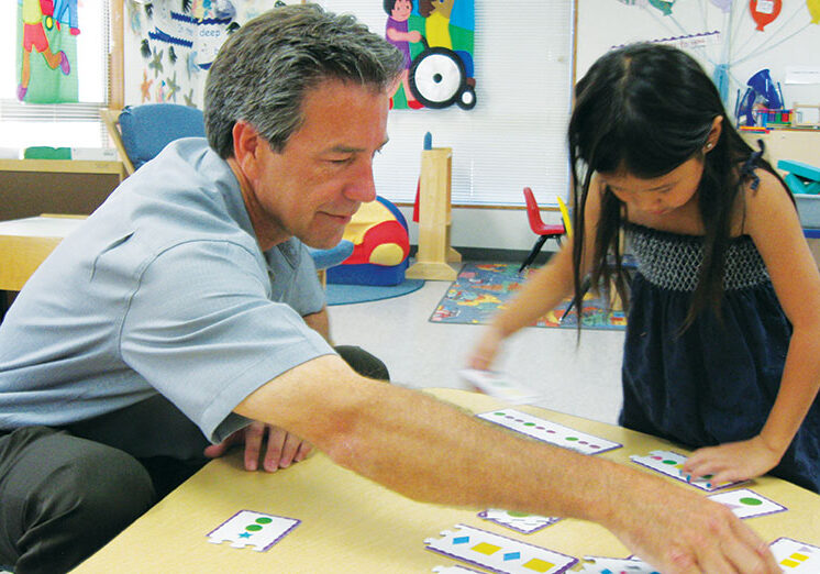 Shasta County Superintendent of Schools Tom Armelino shares fun learning time with Kaylina of Alta Mesa State Preschool.