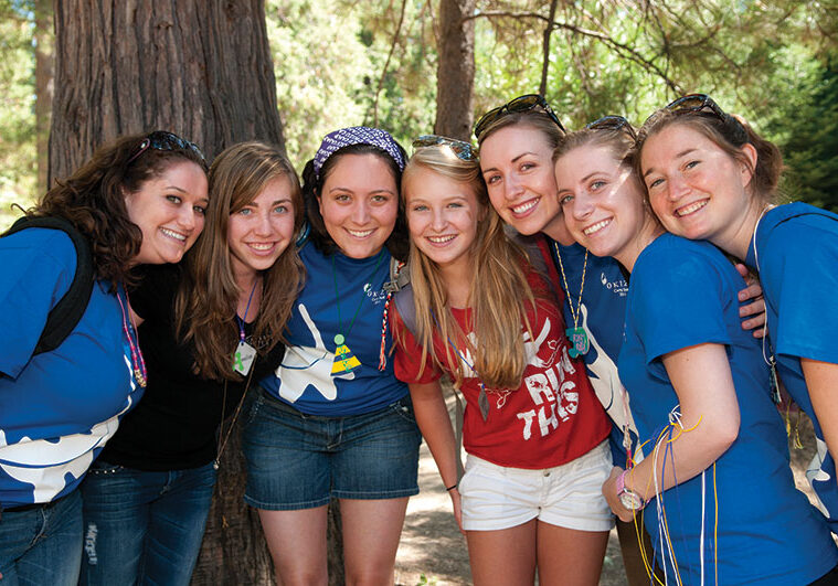 Oncology Camp participants Annelise Green-Burke (2nd from left) and Sadie Cibula (in red),  both originally from Shasta County, with Okizu camp counselors. Photo: Michael Burke. www.burkephotography.biz